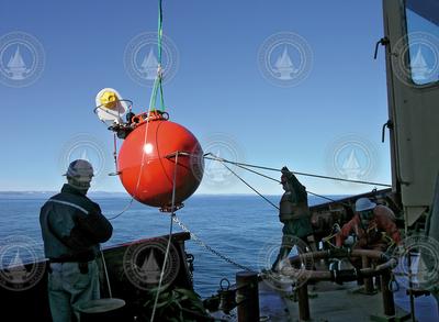 A flotation sphere fitted with an Arctic winch is deployed into Hudson Strait.