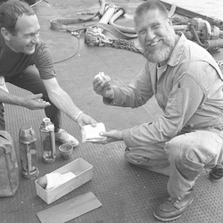 Cliff Winget holding a sandwich from the salvaged DSV Alvin.