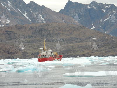Ferry and cargo ship Johanna Kristina moving through heavy sea ice.