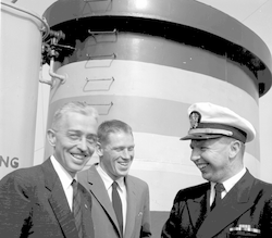 Paul Fye and Dick Edwards with unknown Naval officer.