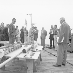 Group on WHOI dock looking at buoy.