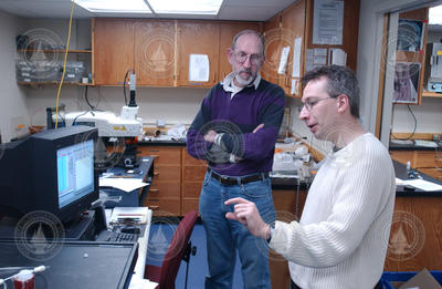 David Schneider and Bernhard Peucker-Ehrenbrink working in the lab.