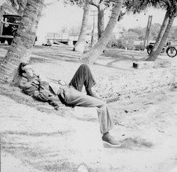 Jan Hahn relaxing under a tree in the tropics