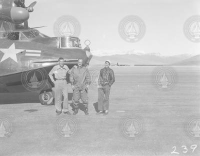 Chuck Wilkins, F.S. Matthews and Ed Chute next to PBY aircraft