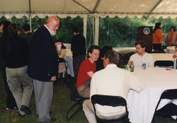 John Farrington talking with students at the 1998 Graduate Reception.