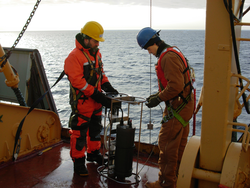 David Griffith (right) recovering a pump in the Arctic.