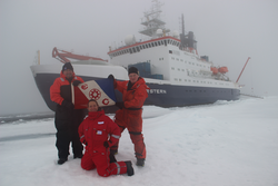 Chris German, Louis Whitcomb and Antje Boetius on the ice in front of Polarstern.