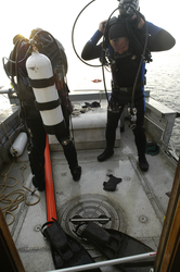Jay Sisson with Pat Lohman, preparing for dive to recover a tripod buried in sand