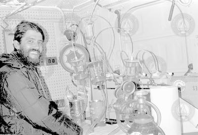 Unidentified man in lab below deck of Gosnold