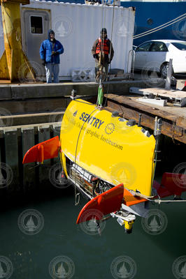 AUV Sentry is lowered into the dock well during tests.