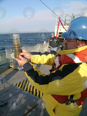 Bruce Keafer holds a sediment sample retrieved from the Gulf of Maine.