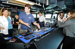 Captain Mike Hoshlyk showing NSF associates the bridge on R/V Sikuliaq.