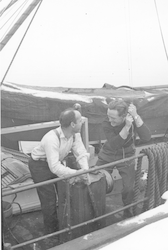Two men on deck of the Anton Dohrn in the winter