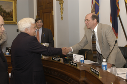Terry Joyce shakes hands with Congressman Gilchrest.