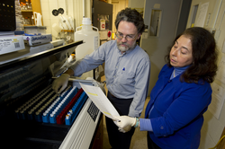 Mark Hahn and Diana Franks working in the lab.