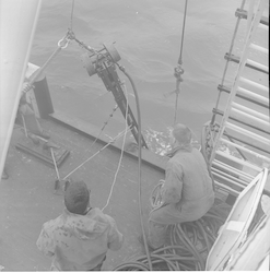 Hydraulic corer going into water from deck of Bear