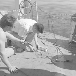 Steve Stillman and unidentified person on the Atlantis II during the Thresher search.