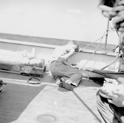 Maurice Ewing asleep on deck of Atlantis