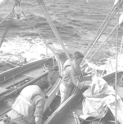 Two unidentified men during life boat drill
