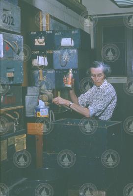 Dot Rogers holding drift bottle