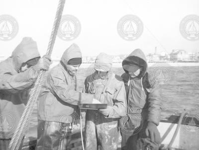 Lloyd "Tex" Hoadley [second from left] aboard Asterias