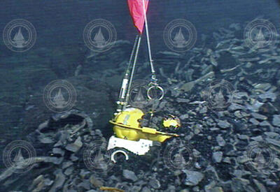Ocean-Bottom Seismometer (OBS) buried and awaiting rescue.