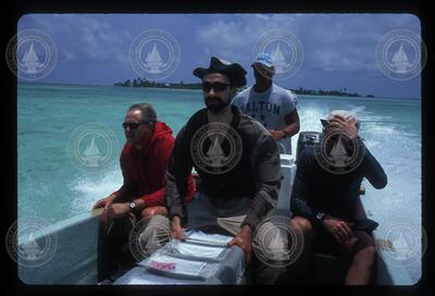 REMUS Scientists and crew on boat during transit.