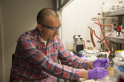 Chris Reddy working with Isochrysis algae in his lab.