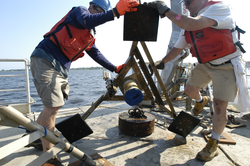 Ian Hanley and Jay Sisson move an ADCP tripod.