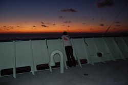 Nika Staglicic on open deck during sunrise.