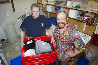 Donor Harry Hollum and Ken Buesseler with one of Buesseler's sample kits.