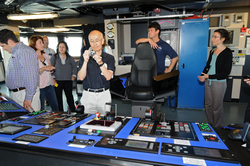 Captain Mike Hoshlyk showing NSF associates the bridge on R/V Sikuliaq.