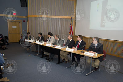 Panel of colloquium participants interacting with the audience.