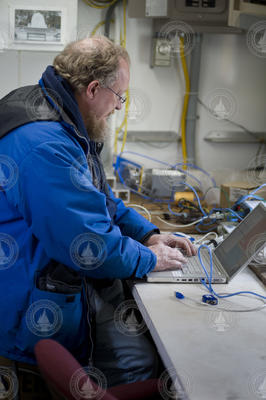 Al Duester testing the programming of AUV Sentry at the dock.