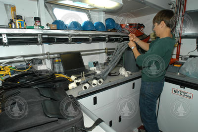 Heidi Sosik works on the power supply for the flow cytometer.