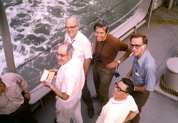 Kenneth O. Emery [with box in hand] with 5 unidentified men