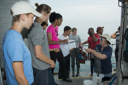 Cindy Sellers (right) working with students to analyze water samples.