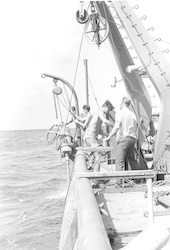 Group working on deck with corer