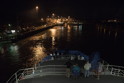 People on board R/V Neil Armstrong as it transits into the Miraflores locks.