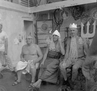 Three men during line crossing ceremony