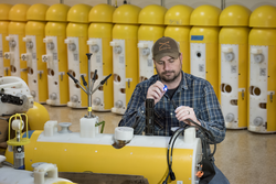 Brian Hogue working on moored profilers in the lab.