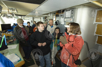 Amy Bower showing students around the Pilot House.