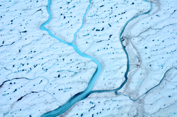 Aerial view of Greenland meltwater streams.
