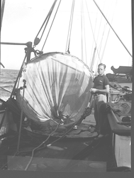 Jack Welsh stands next to a 2-meter net on deck.