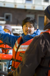 Justin Fujii and Sean Kelley preparing Sentry for launch at the WHOI dock.