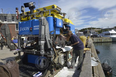 Korey Verhien working on ROV Jason at the WHOI dock.