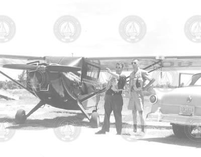 Robert Weeks and Allard T. Spencer next to Stinson aircraft