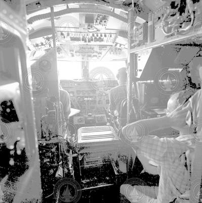 Flight Deck of C54Q aircraft - Radio Operator Frank Matthews in foreground