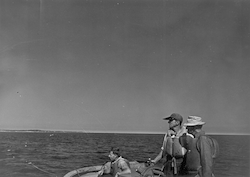 Stan Poole with others aboard unidentified boat