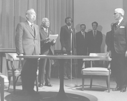 Emperor Hirohito and Paul Fye gathered around a table during the Emperor's visit.